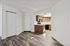 Dining area at Silver Creek with wood floors and view into kitchen