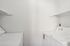 Laundry room with white appliances