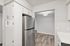 Kitchen at Peoria Grand with stainless steel fridge and white cabinets