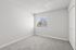 Bedroom at Peoria grand with closet and window, light grey carpet and light grey walls