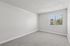 Bedroom at Peoria grand with closet and window, light grey carpet and light grey walls