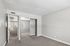 bedroom at Solaris at the biltmore with carpet and grey paint and a closet with mirrored doors
