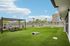 outdoor courtyard with cornhole and a community firepit