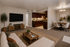 Virtually staged living room and dining room at soliars at the biltmore with a couch and tv and dining area