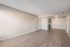 Spacious living and dining area at Solaris at Shadow Mountain with modern wood-style flooring.