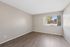 Bedroom at Solaris at Shadow Mountain featuring vinyl plank flooring and a large window.