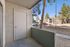 Private concrete patio with an outdoor storage closet and views of the community.