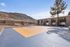 Outdoor basketball court with blue and orange surfacing at Solaris at Shadow Mountain.