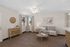 Virtually Staged living room at Orchard Mesa with a couch, coffee table and entry table