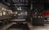 Chic game room with a stylish pool table, modern art gallery wall, and cozy lounge area.