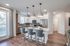 kitchen island with pendant lighting in townhomes | Apartments in Cypress, TX | Cypress, TX Townhomes | Apartments in Bridgeland | Townhomes in Bridgeland