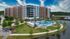 Exterior view of apartment and grounds at Two Lakes Edge The Woodlands | Apartments in The Woodlands | The Woodlands, TX Apartments | Luxury Apartments in Woodlands | Two Lakes Edge