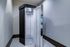 Modern tanning booth in a sleek white and black design, perfect for luxurious home spa experiences.