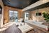 Yoga studio with mirrored wall, floor cushions, wall mounted screen, and sliding doors to the pool courtyard