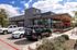 Neighborhood retail near Cedar Park apartments with Hopdoddy and First Watch storefronts and patio seating