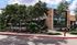 Neighborhood coffee shop with shaded patio seating and oak trees near Cedar Park apartments