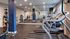 Fitness center with treadmills, ellipticals and medicine ball rack