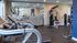 Fitness center with treadmills, weight machine and mirrored wall