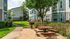 Picnic area with charcoal grill, picnic table and courtyard lawn