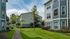 Courtyard with walkway, lawn and three-story buildings, Houston, TX