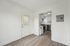 Modern kitchen with sleek appliances and light wood flooring, offering a bright and welcoming space.