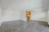Spacious and bright open-plan living area with modern wood flooring and elegant recessed lighting, perfect for stylish entertaining.
