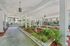 Charming apartment courtyard with vibrant greenery, elegant fountains, and inviting pathways.