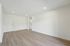 Bright and airy apartment with modern hardwood floors, recessed lighting, and a convenient in-unit washer and dryer.