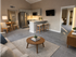 Modern open-concept living space with cozy seating area, sleek kitchen, and dining nook, perfect for entertaining and relaxation.