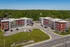 Modern residential complex set amidst lush greenery, featuring sleek architectural design with red and gray facades.