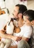 Happy couple enjoying quality time with their dog in a cozy, pet-friendly apartment.