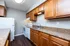 Charming kitchen with stylish wooden cabinets, modern appliances, and sleek granite countertops.