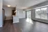 Bright and elegant open-plan apartment with a modern kitchen, spacious living area, and large windows offering natural light.