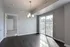 Bright dining area with elegant pendant lighting and large sliding glass doors opening to a balcony, perfect for natural light and outdoor views.