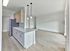 Modern open-concept kitchen with island and stainless steel appliances at Crestwood Apartments in Wayne, PA