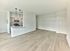 Open-concept layout with modern kitchen and wood-style flooring at Crestwood Apartments in Wayne, PA