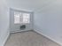 Renovated bathroom with white vanity, modern lighting, and natural light at Crestwood Apartments in Wayne, PA