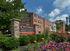 Crestwood Apartments community sign with vibrant flowerbeds and classic brick exterior in Wayne, PA