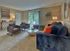 Spacious living room with sliding glass door to patio