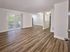 Open floor plan with plank flooring