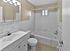 Upgraded bathroom with custom tile