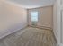 Bedroom with wall-to-wall carpeting