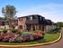 Lush landscaping and perfectly manicured lawns at Woods Edge Apartments