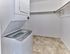 In-unit Whirlpool washer and dryer with spacious walk-in closet at Maple Grand Apartments in Maple Shade, New Jersey.