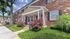 Charming red brick exterior with colorful landscaping and private entrance at Maple Terrace Apartments in Maple Shade, NJ