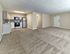 Spacious open-concept living and dining area with updated kitchen at Audubon Arms Apartments in Audubon, NJ