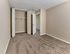 Spacious bedroom with plush carpet and large closet at Audubon Arms Apartments in Audubon, NJ