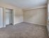 Spacious bedroom with open closet, carpet flooring, and natural light at 42 West Apartments in Merchantville, NJ
