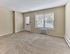 Living room with large window, natural light, and wall-to-wall carpet at 42 West Apartments in Merchantville, NJ