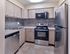 Renovated kitchen with stainless steel appliances and modern cabinetry at 42 West Apartments in Merchantville, NJ